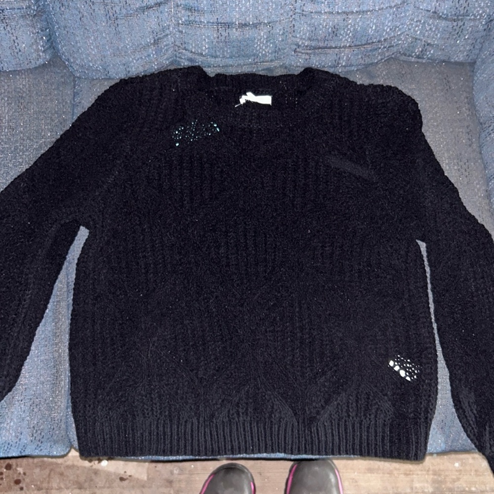 Black long sleeve sweater.